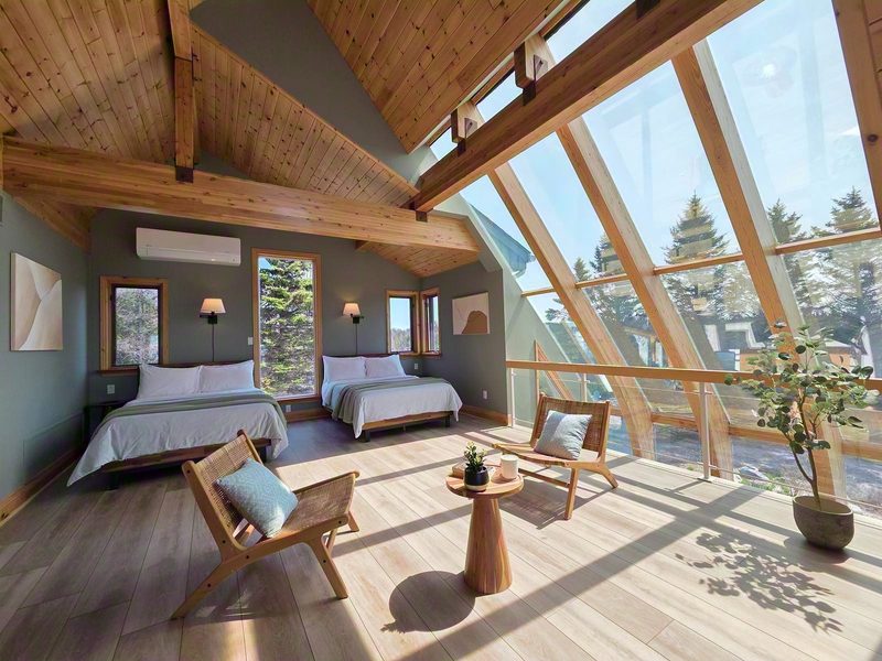 Cielo, the loft bedroom with two full beds under the angled sky windows